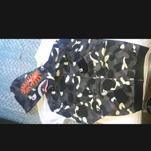 Camo glow in the dark Bape hoodie. Fits like an Adult Medium.